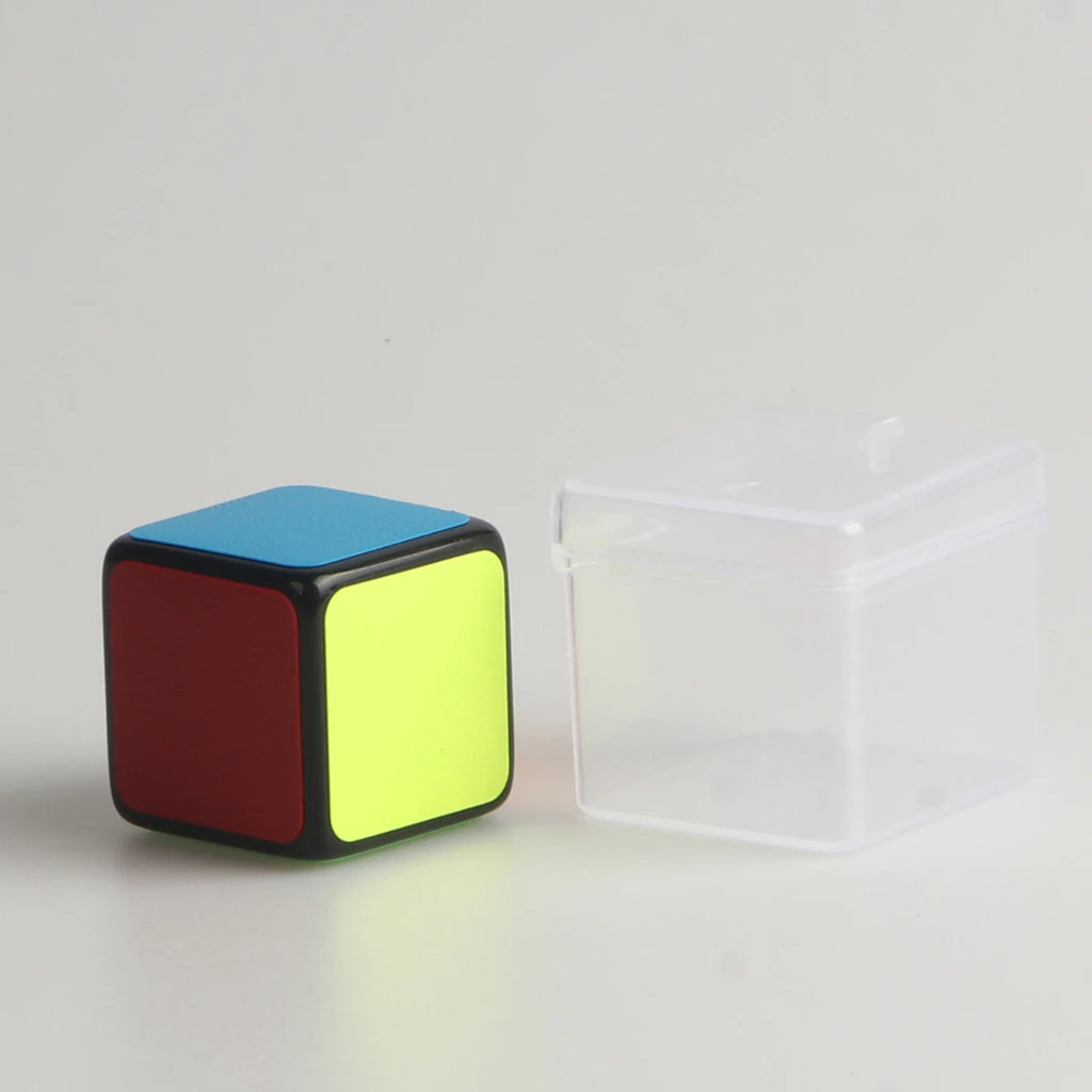 1x1 Mini Puzzle Cube displayed beside its clear plastic storage box